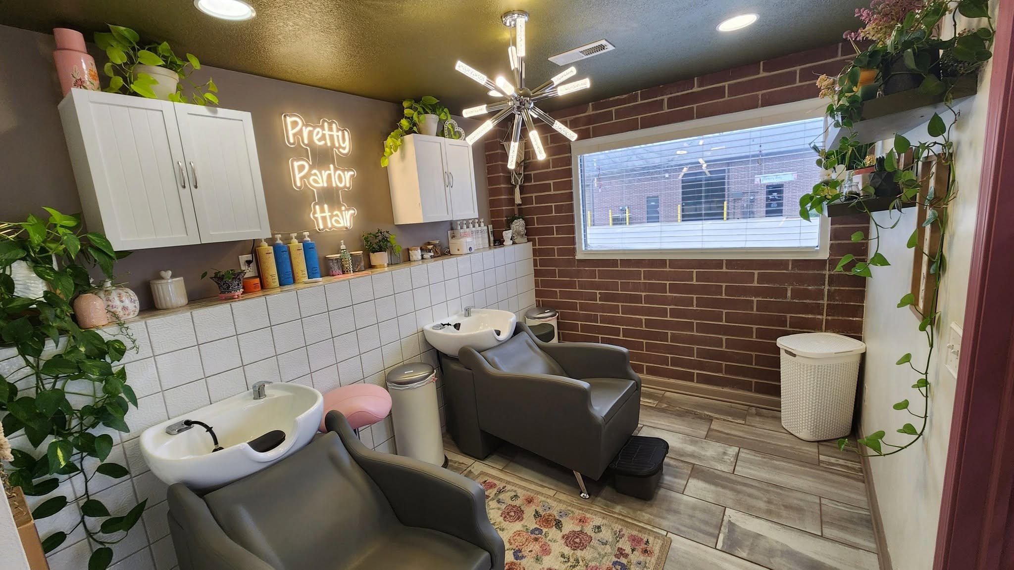Wash stations and greenery inside Pretty Parlor Hair